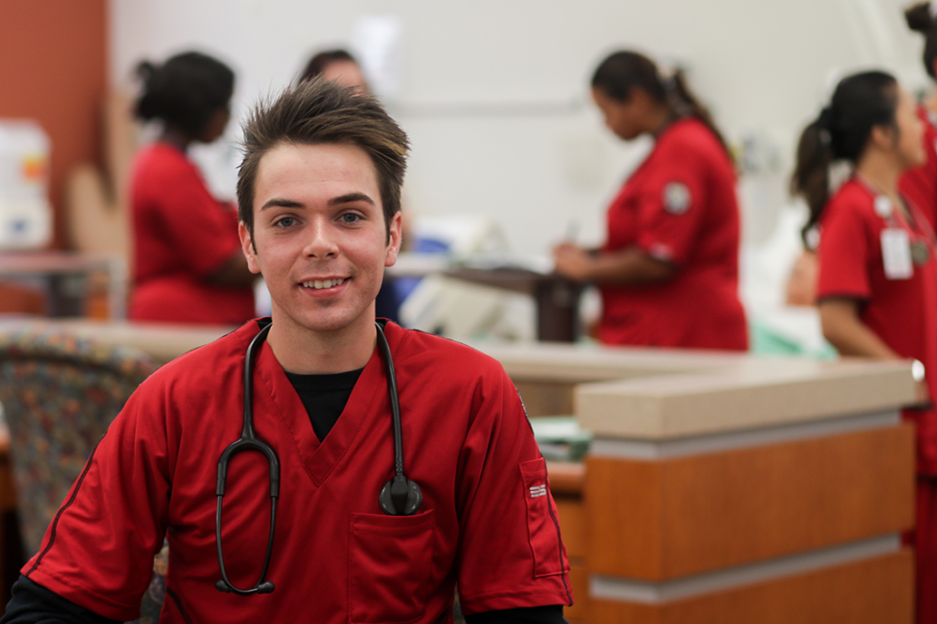 Oliver Smith poses for photo in McCord nursing lab